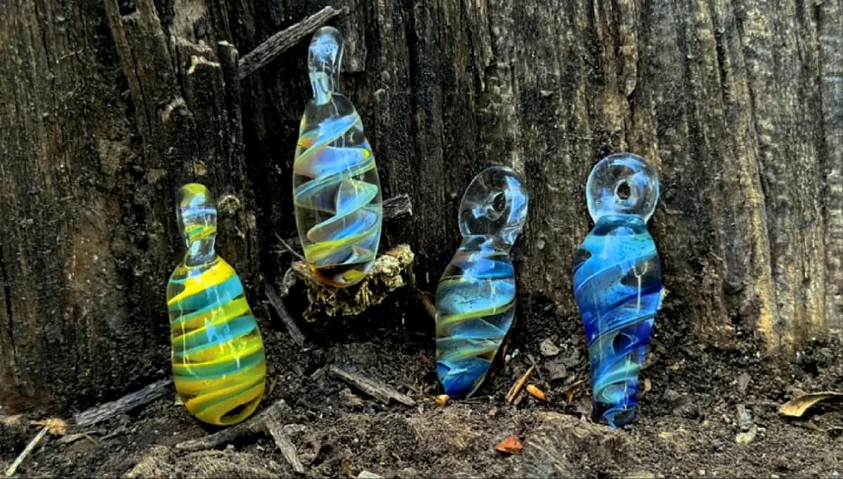 Striped glass pendants standing in bark